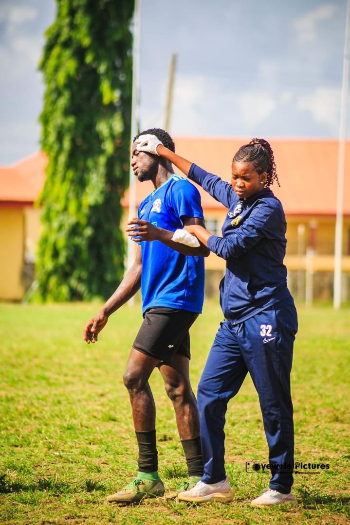 Academy medical staff attending to a KEDOPEACH player